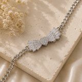 Crystal Baguette Bow & Pavé Heart Curb Chain Bracelet – Silver