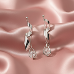 Spiral Twist Crystal Drop Earrings on Blush Satin
