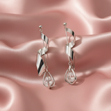 Spiral Twist Crystal Drop Earrings on Blush Satin