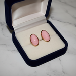 Pink Oval Cabochon Gold Frame Stud Earrings on White Marble