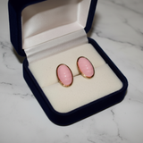 Pink Oval Cabochon Gold Frame Stud Earrings on White Marble