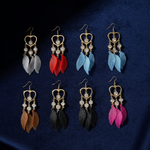 Gold Heart Crystal Feather Drop Earrings on Navy Velvet