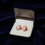 Pink Oval Cabochon Gold Frame Stud Earrings on Navy Velvet