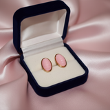 Pink Oval Cabochon Gold Frame Stud Earrings on Blush Satin